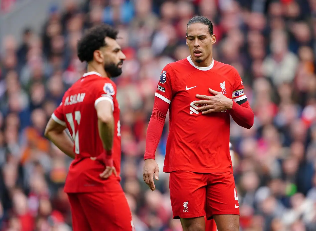 Liverpool’s Mohamed Salah and Virgil van Dijk react during the Premier League match against Crystal Palace at Anfield