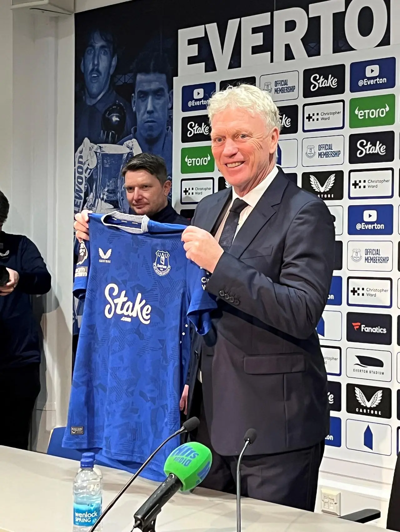 David Moyes holds an Everton shirt at a press conference after returning as manager