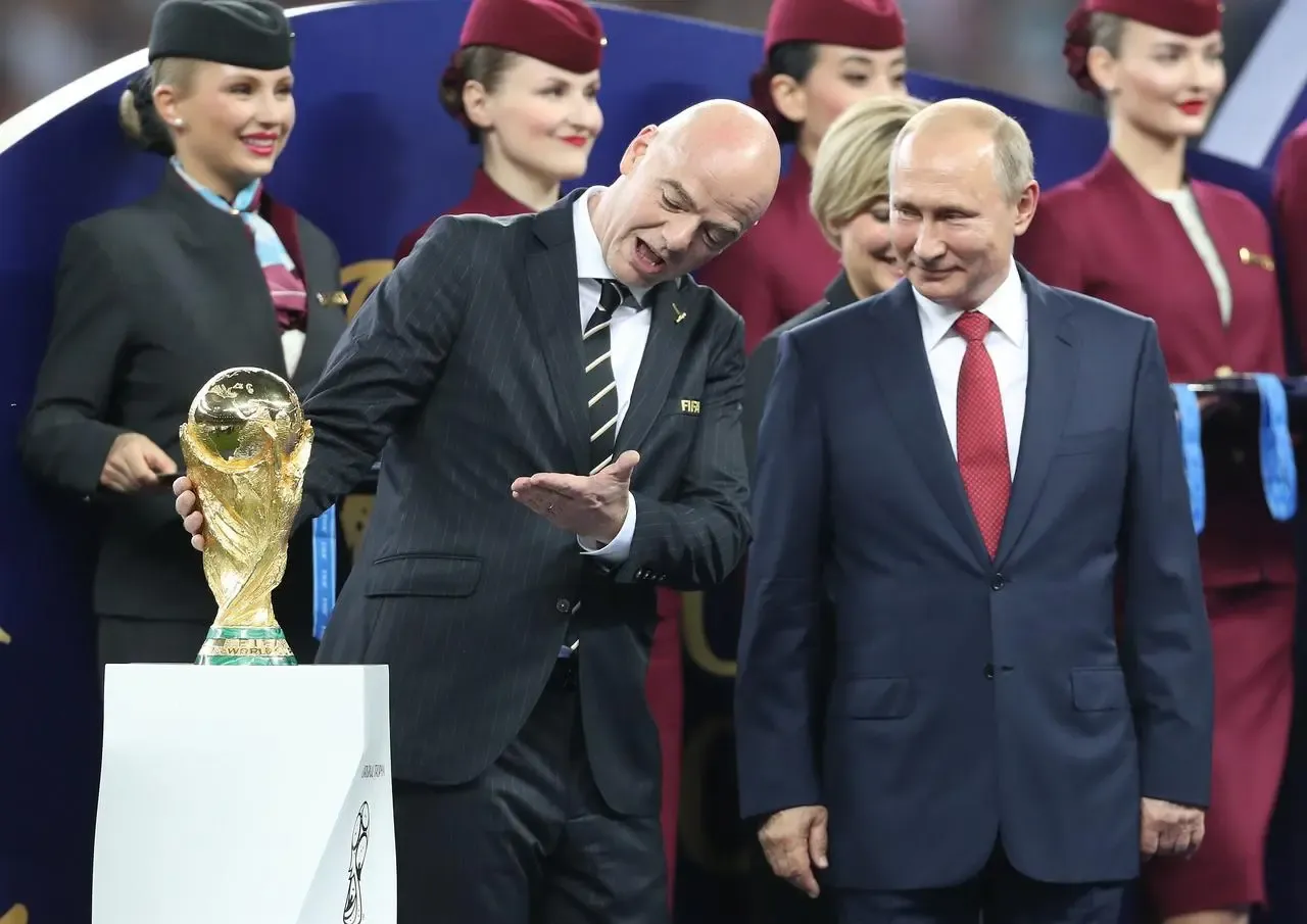 FIFA President Gianni Infantino (left) and Russian President Vladimir Putin with the World Cup trophy prior to the start of the trophy presentation after the FIFA World Cup Final at the Luzhniki Stadium, Moscow