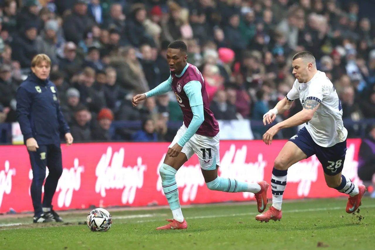 Milutin Osmajic runs after Burnley winger Jaidon Anthony