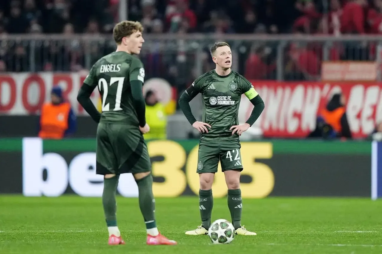 Callum McGregor (right) stands dejected after Bayern's late equaliser