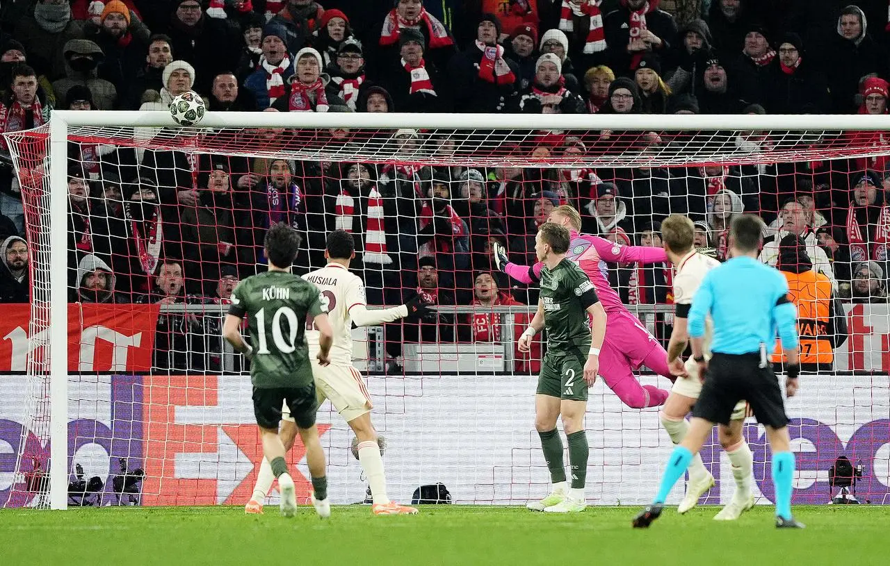 Bayern Munich’s Harry Kane, partially hidden, hits the crossbar against Celtic