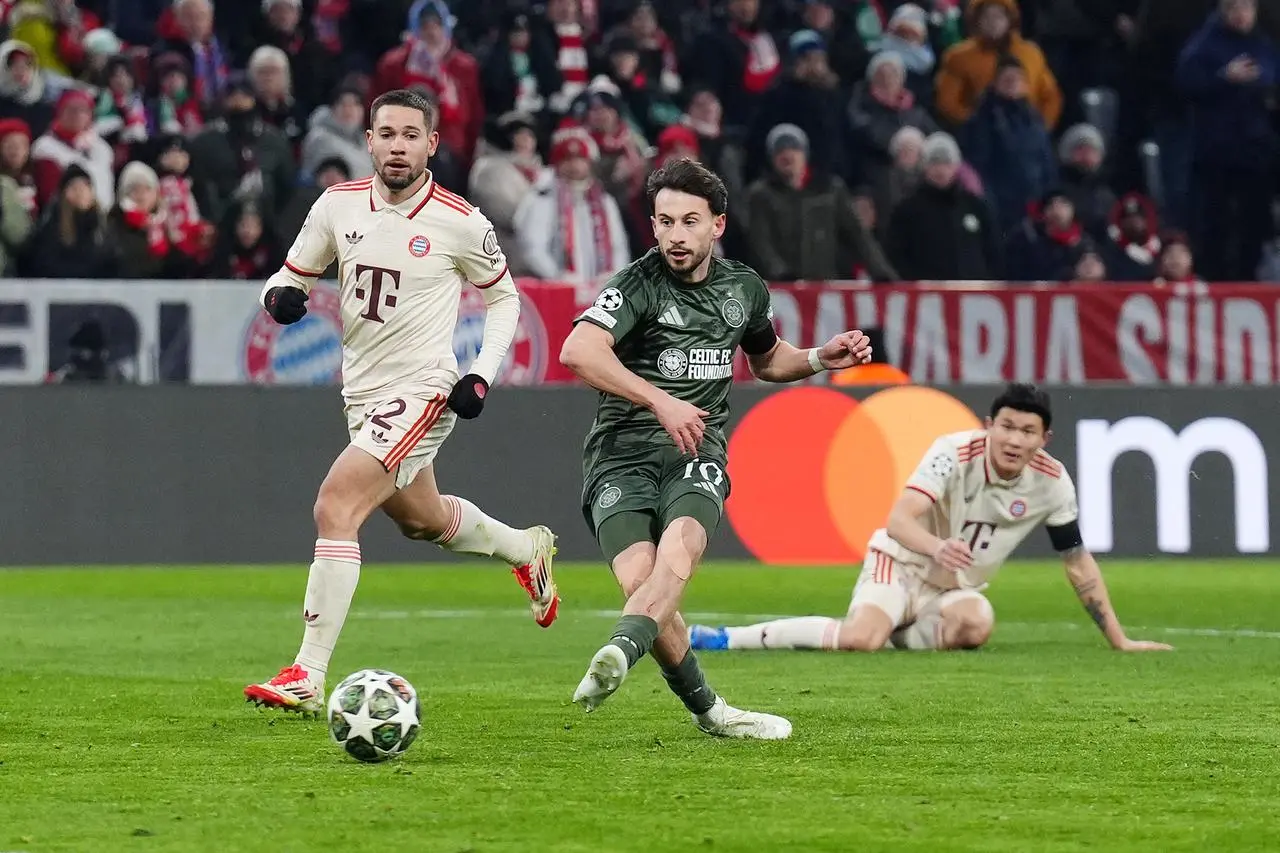 Nicolas Kuhn, centre, scores Celtic’s goal against Bayern Munich