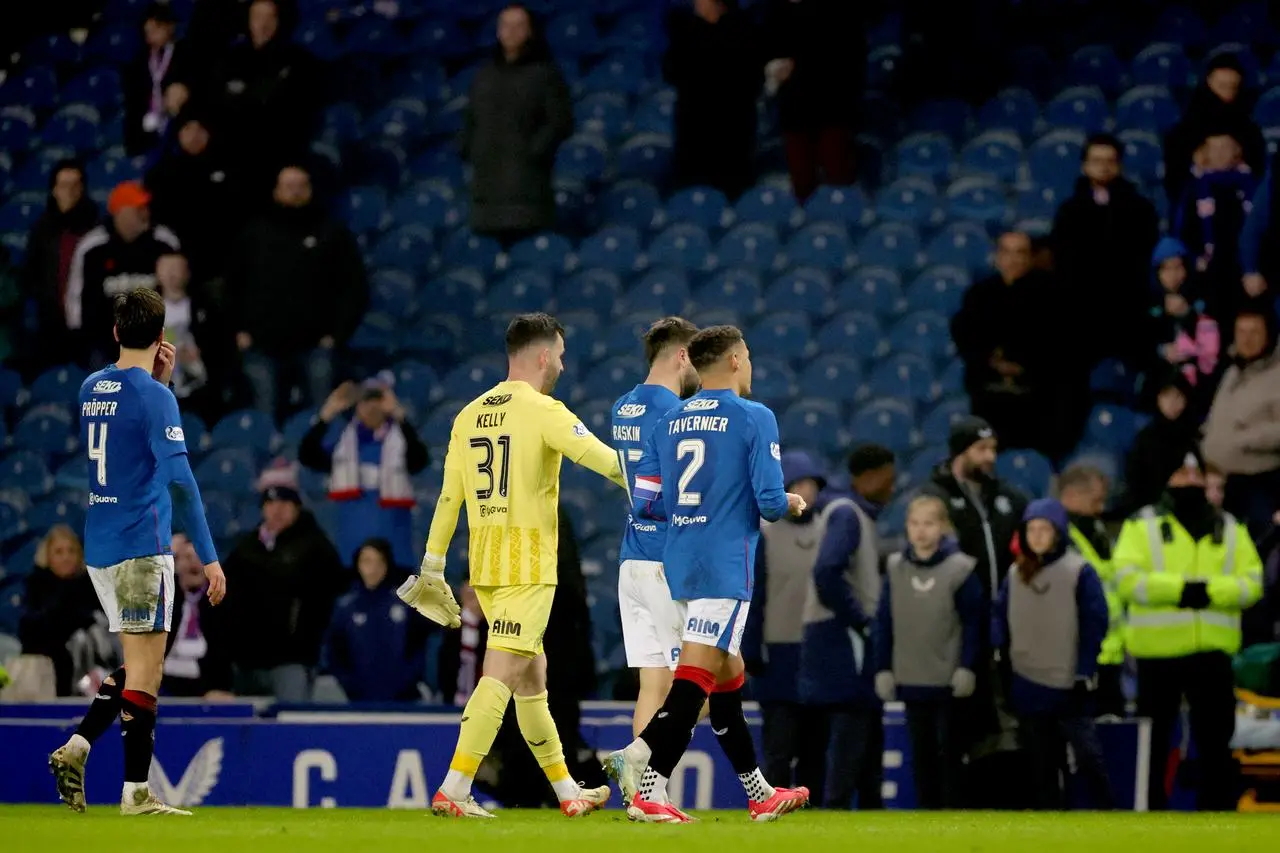 Rangers players Robin Propper, Liam Kelly, Nicolas Raskin and James Tavernier, left to right, walk off dejected following defeat to Queen's Park