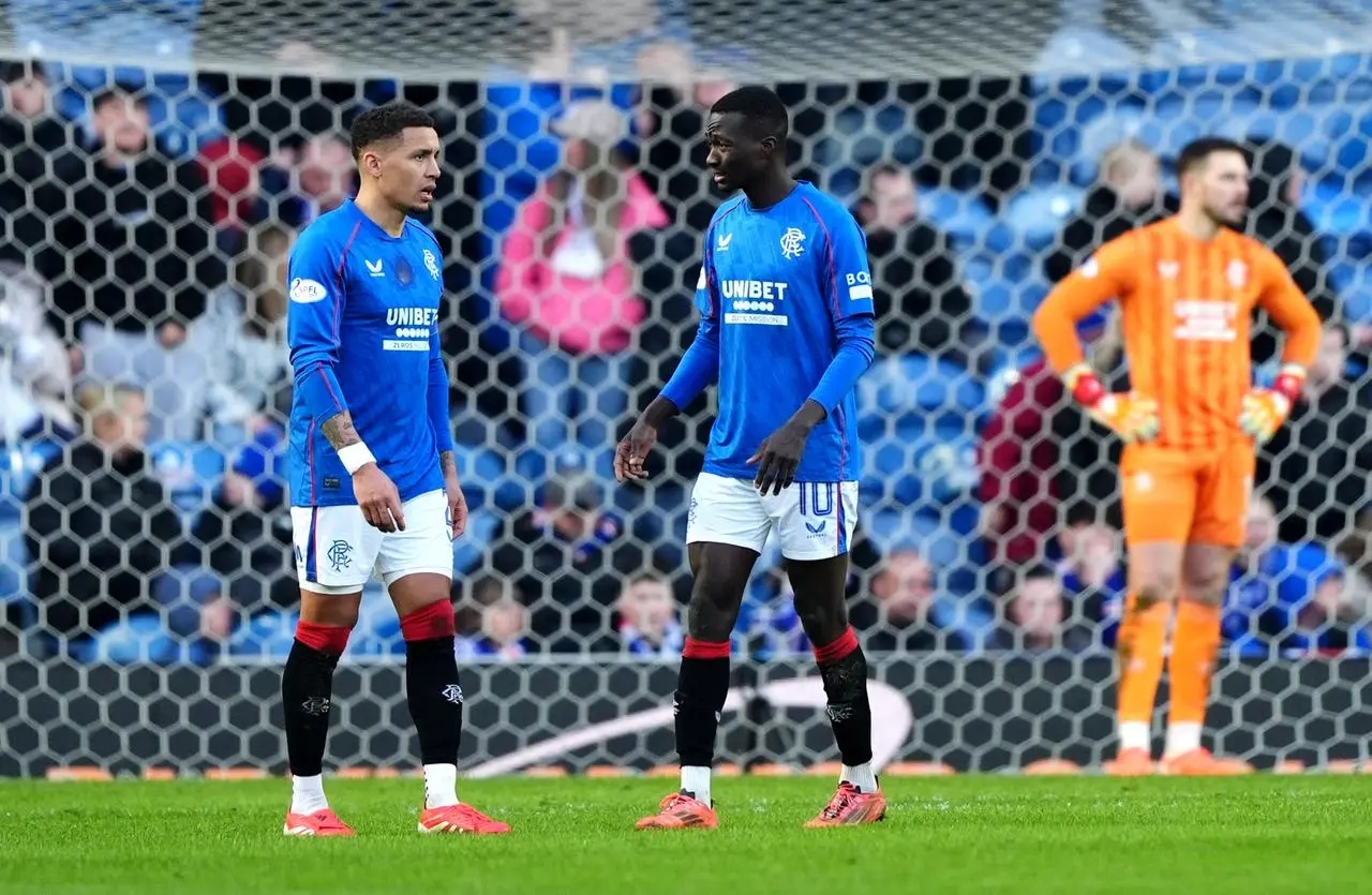 Rangers’ James Tavernier and Mohamed Diomande stand dejected