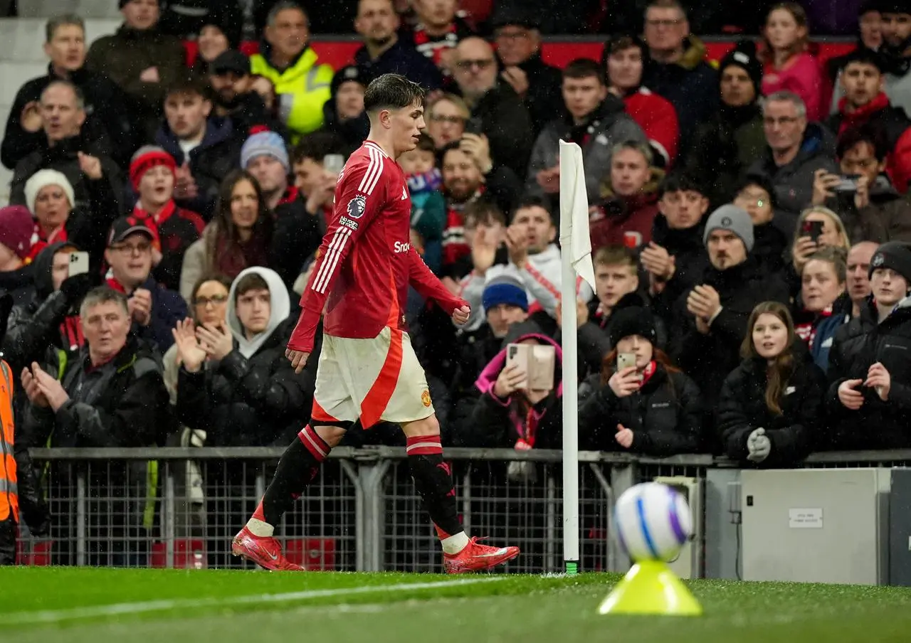 Alejandro Garnacho walks past the corner flag on his way to the tunnel