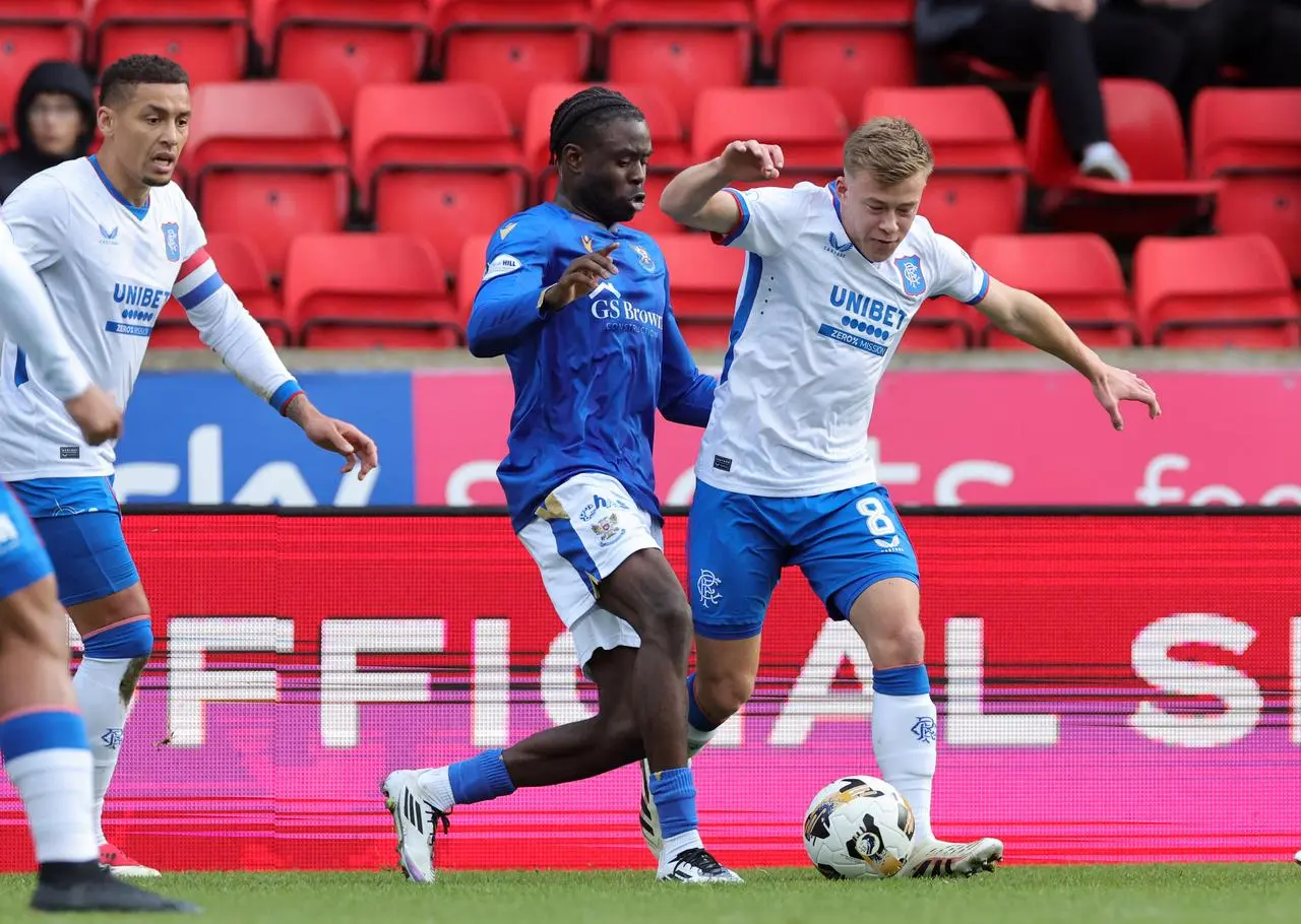 Benji Kimpioka, centre, challenges for the ball against Rangers