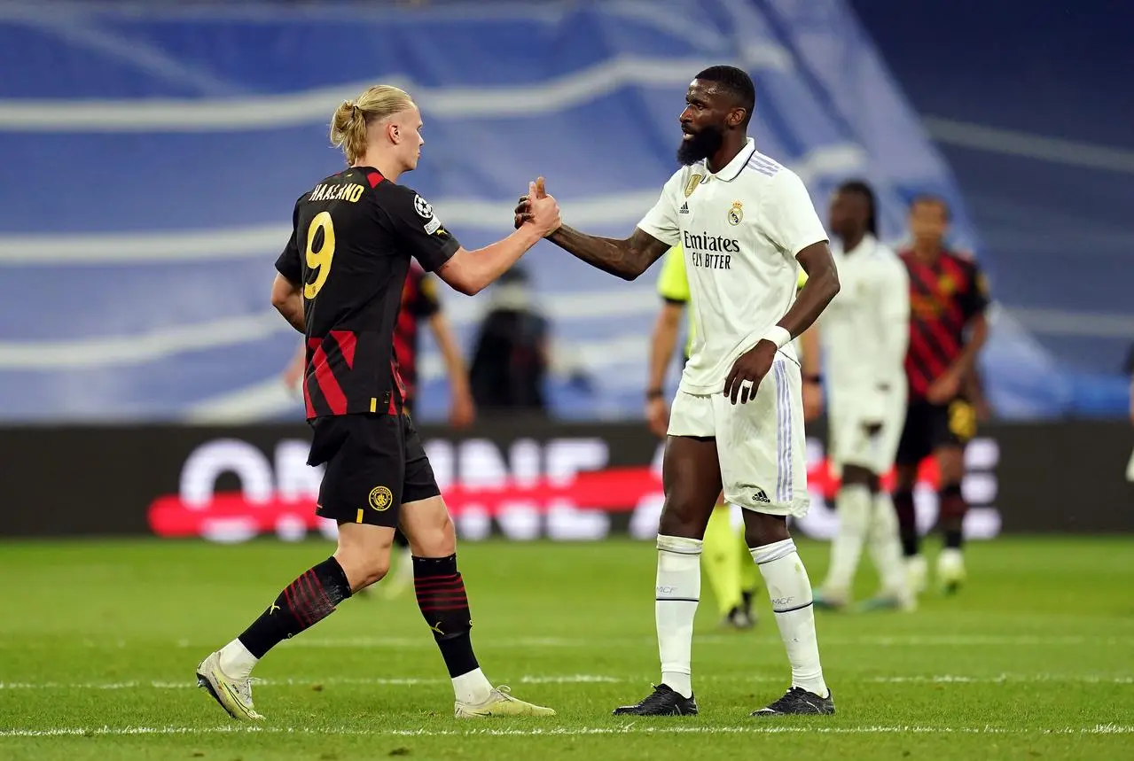 Erling Haaland and Antonio Rudiger shake hands after a game in 2023