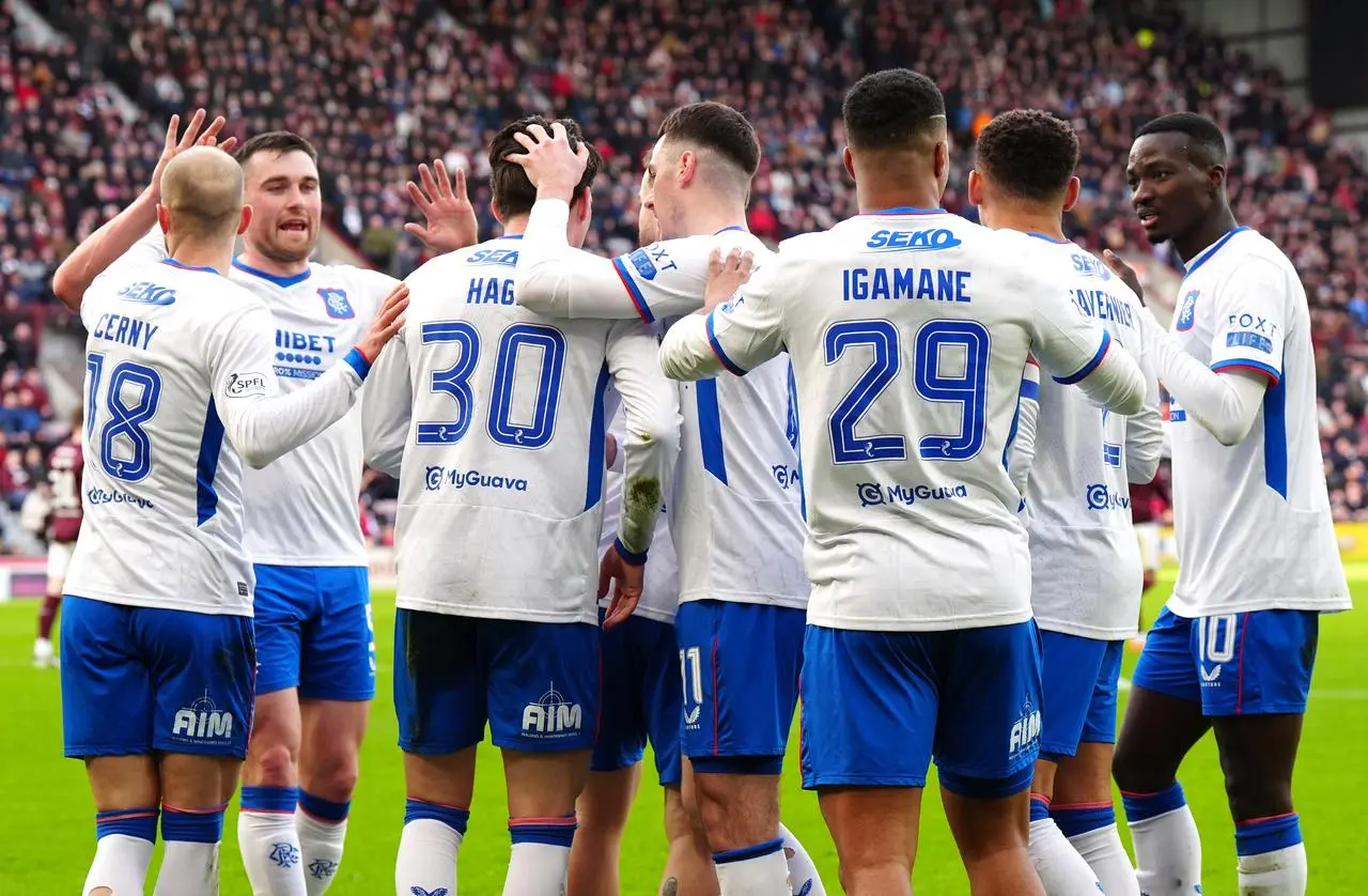 Rangers celebrate after taking the lead through an own goal from Hearts' Jamie McCart, not pictured