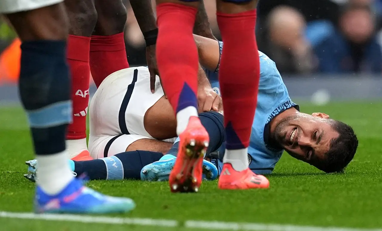 Manchester City's Rodri lies injured during his side's Premier League game against Arsenal last September