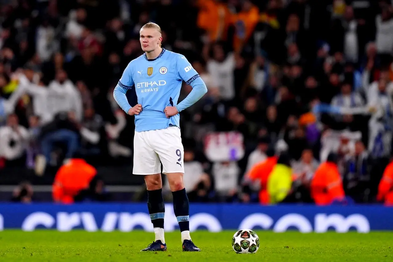 Erling Haaland puts his hands on his hips in frustration after Manchester City lose to Real Madrid