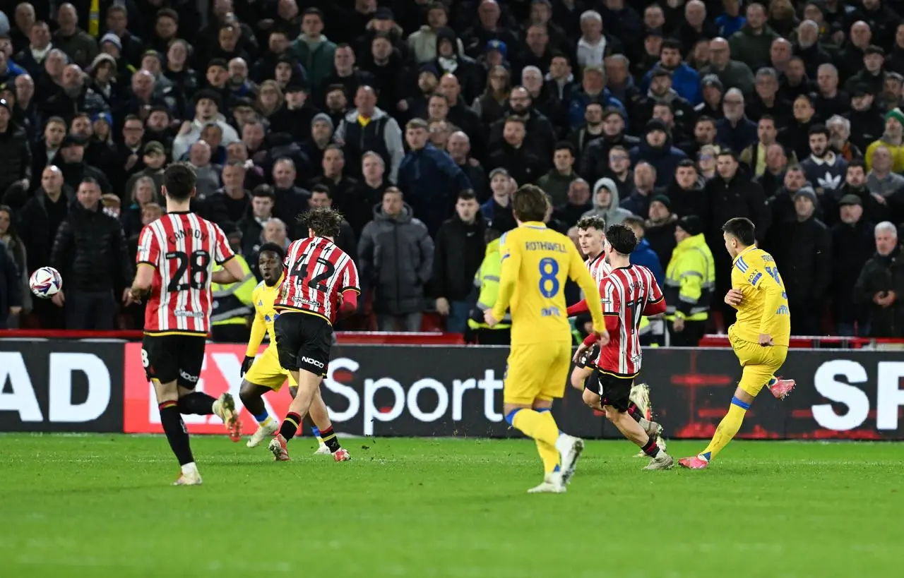 Leeds forward Joel Piroe scores his side's third goal against Sheffield United