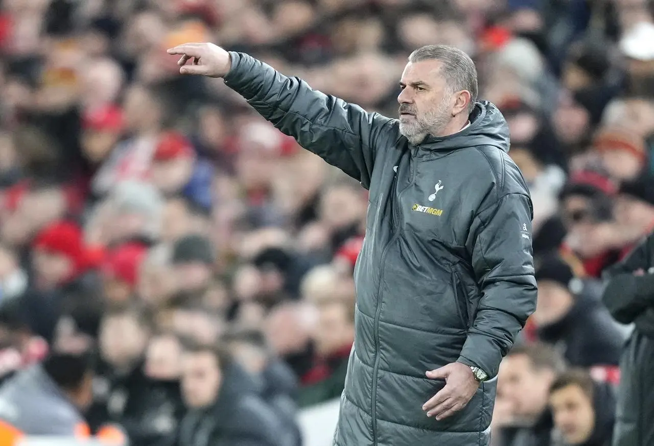 Tottenham manager Ange Postecoglou gestures on the touchline at Anfield