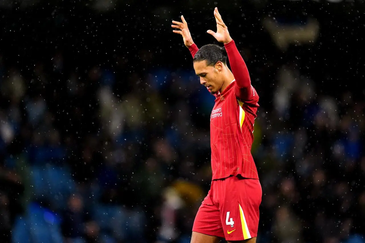 Liverpool’s Virgil van Dijk celebrates their victory at Manchester City