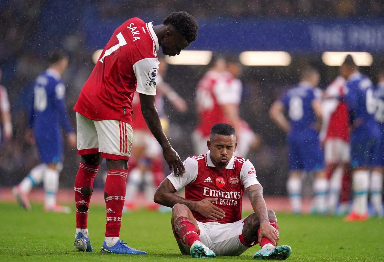 Arsenal’s Gabriel Jesus is checked on by team-mate Bukayo Saka