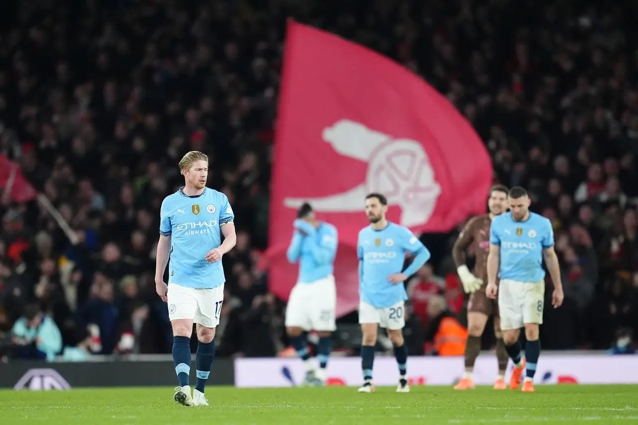 Manchester City’s players look glum after Arsenal score their fifth goal in their 5-1 win at the Emirates Stadium