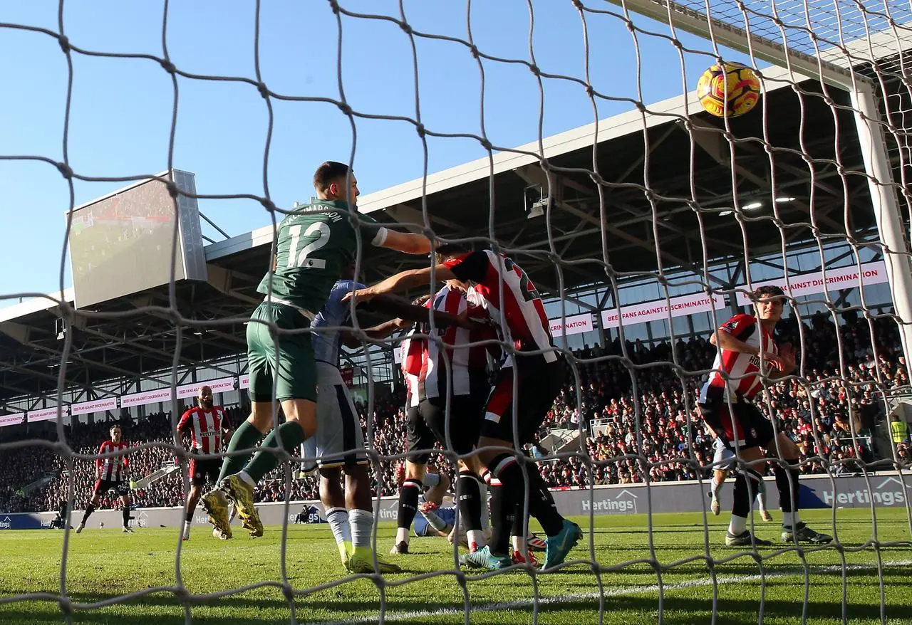 Brentford’s Vitaly Janelt, centre right, scores an own goal for Tottenham’s first goal