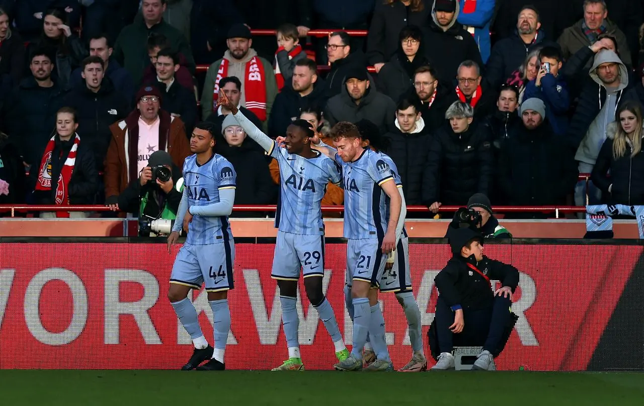 Tottenham's Pape Sarr, centre, celebrates his goal against Brentford