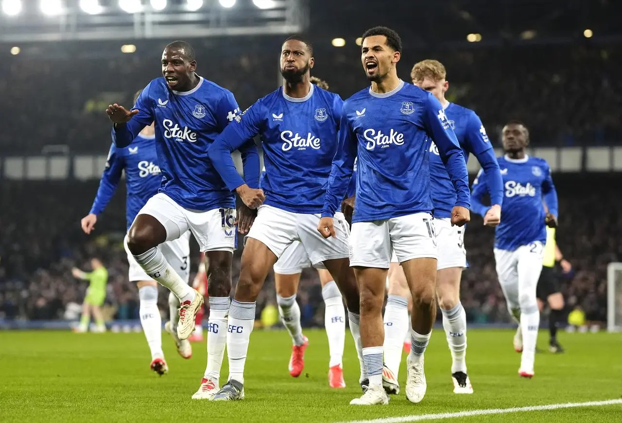 Everton’s Beto, centre, celebrates after scoring against Liverpool