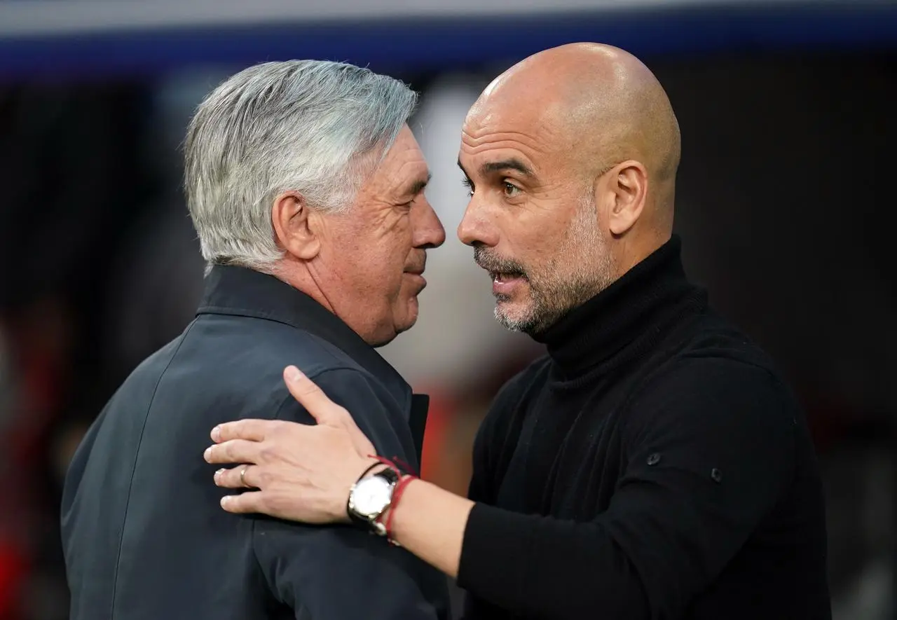Manchester City manager Pep Guardiola with Real Madrid head coach Carlo Ancelotti (left) 