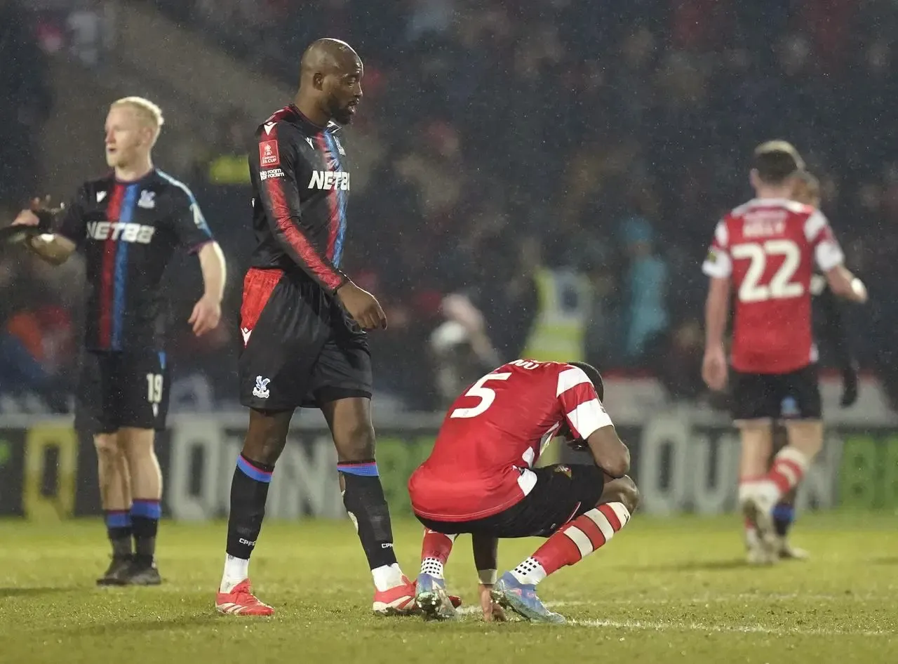 Doncaster Rovers’ Joseph Olowu sits dejected after the FA Cup fourth round defeat by Crystal Palace