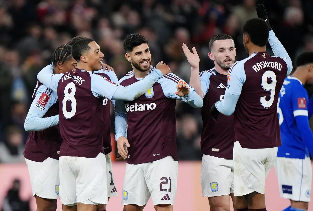 Aston Villa’s Marco Asensio (centre) celebrates