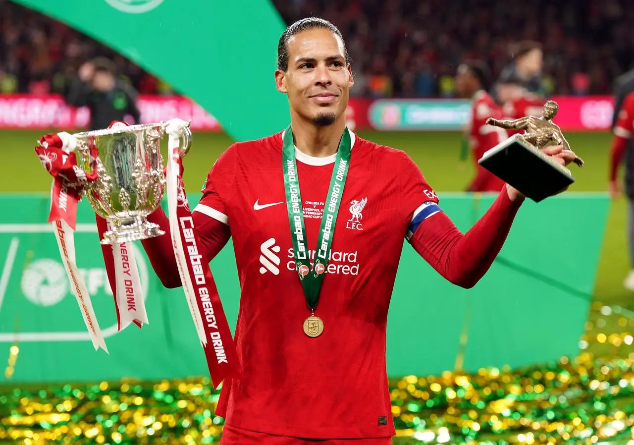  Liverpool captain Virgil van Dijk holds the Carabao Cup and man of the match award