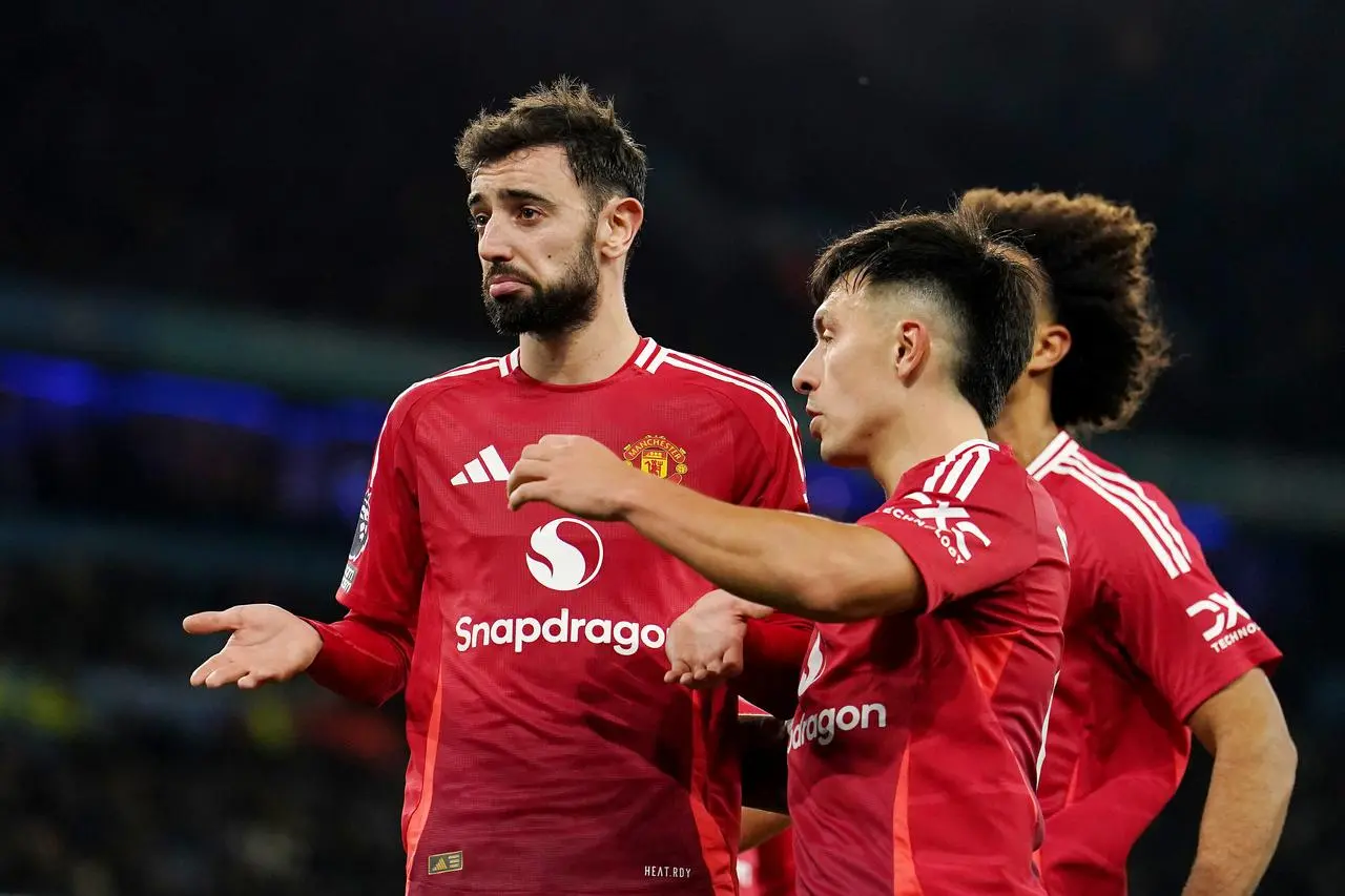 Bruno Fernandes, left, shrugs as he celebrates with team-mates after scoring against Manchester City this season