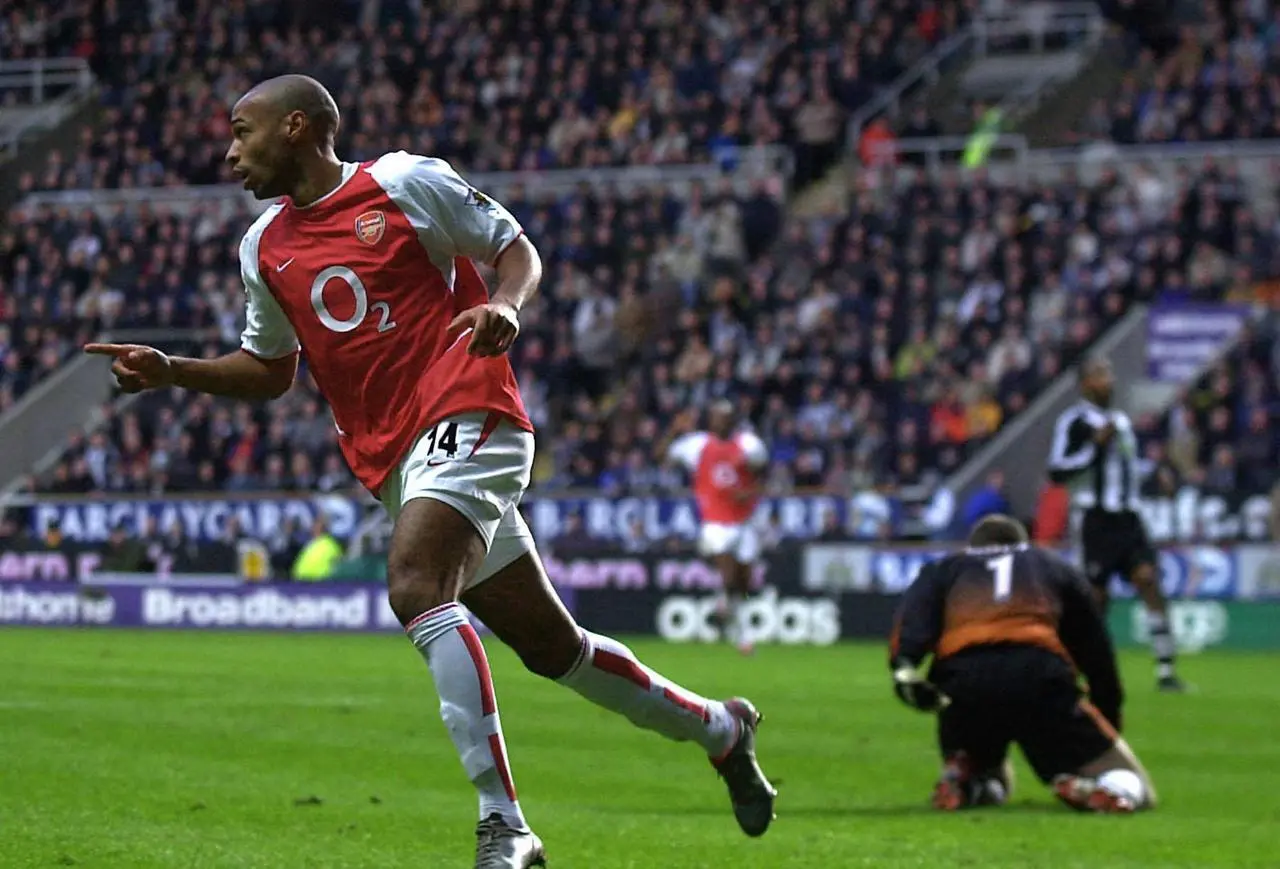 Thierry Henry celebrates scoring for Arsenal against Newcastle in February 2003