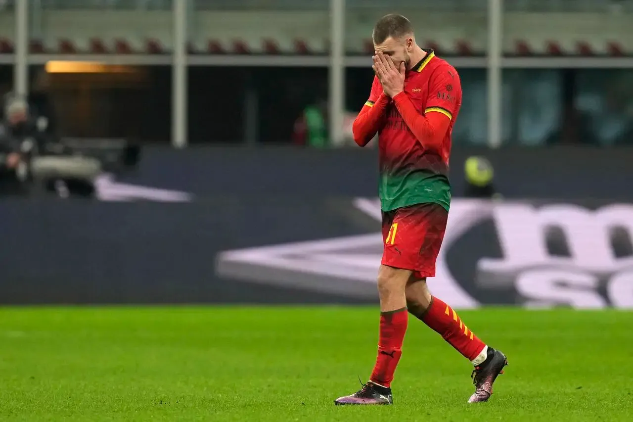 AC Milan’s Strahinja Pavlovic walks off the pitch after being sent off