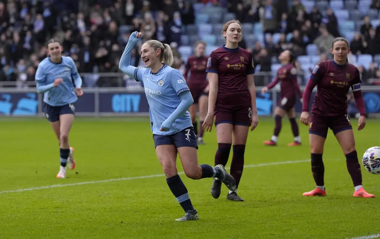 Laura Coombs celebrating her goal