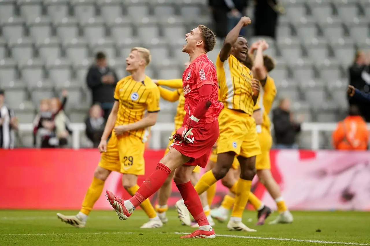 Brighton's Jan Paul van Hecke, Bart Verbruggen and Danny Welbeck, left to right, celebrate with team-mates after their FA Cup win over Newcastle