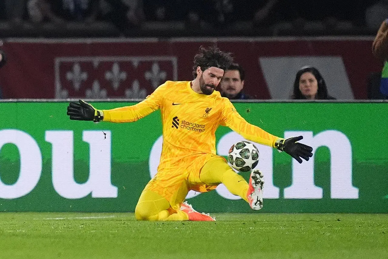 Alisson Becker makes a save 