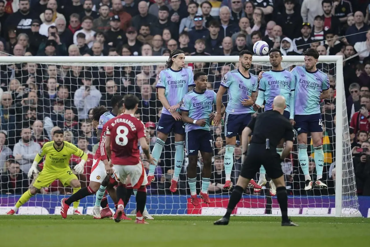 Manchester United's Bruno Fernandes curls his free-kick over the Arsenal wall