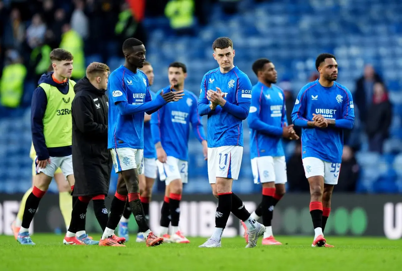 Rangers players applaud the remaining fans after defeat by Motherwell