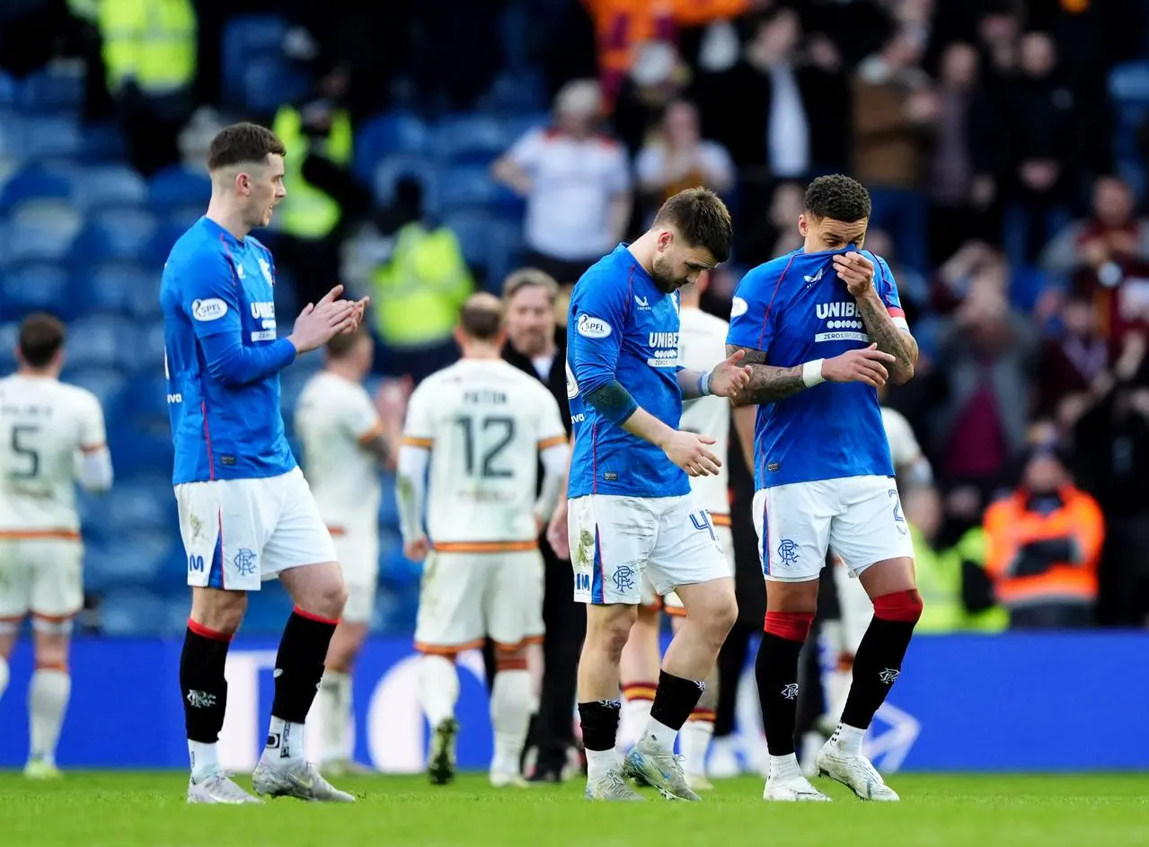 Rangers players look to the ground following their defeat to Motherwell