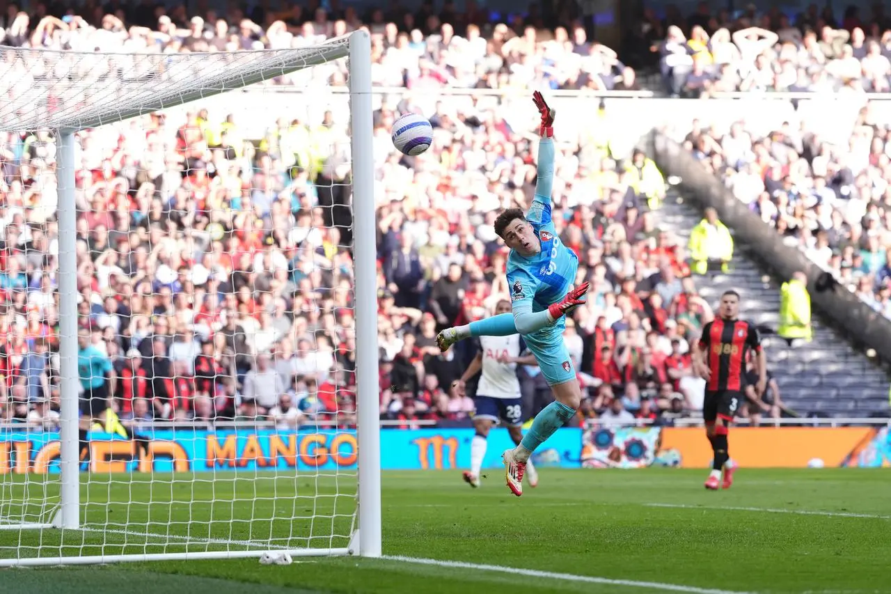 A diving Bournemouth goalkeeper Kepa Arrizabalaga is unable to stop Pape Sarr's cross going into the top corner