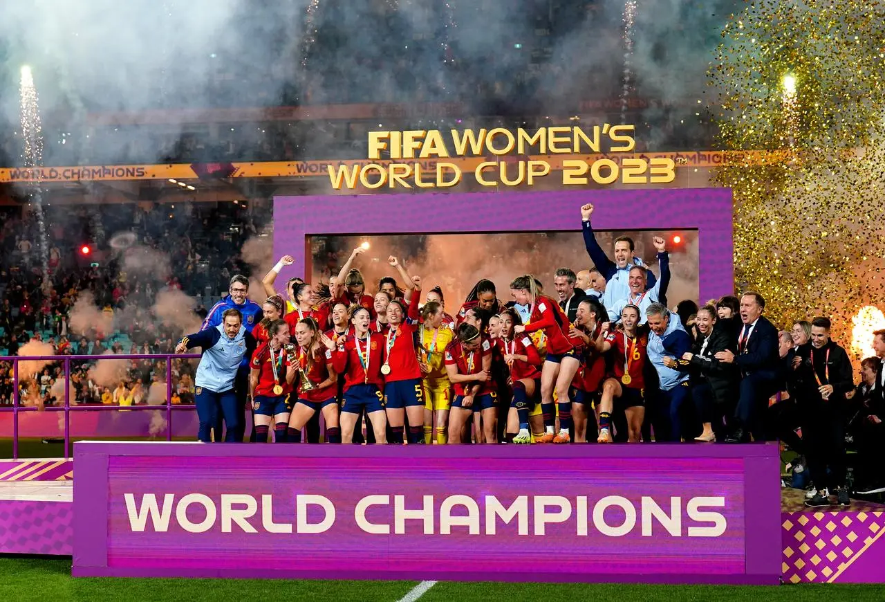 Spain players and staff members celebrate winning the FIFA Women’s World Cup final 