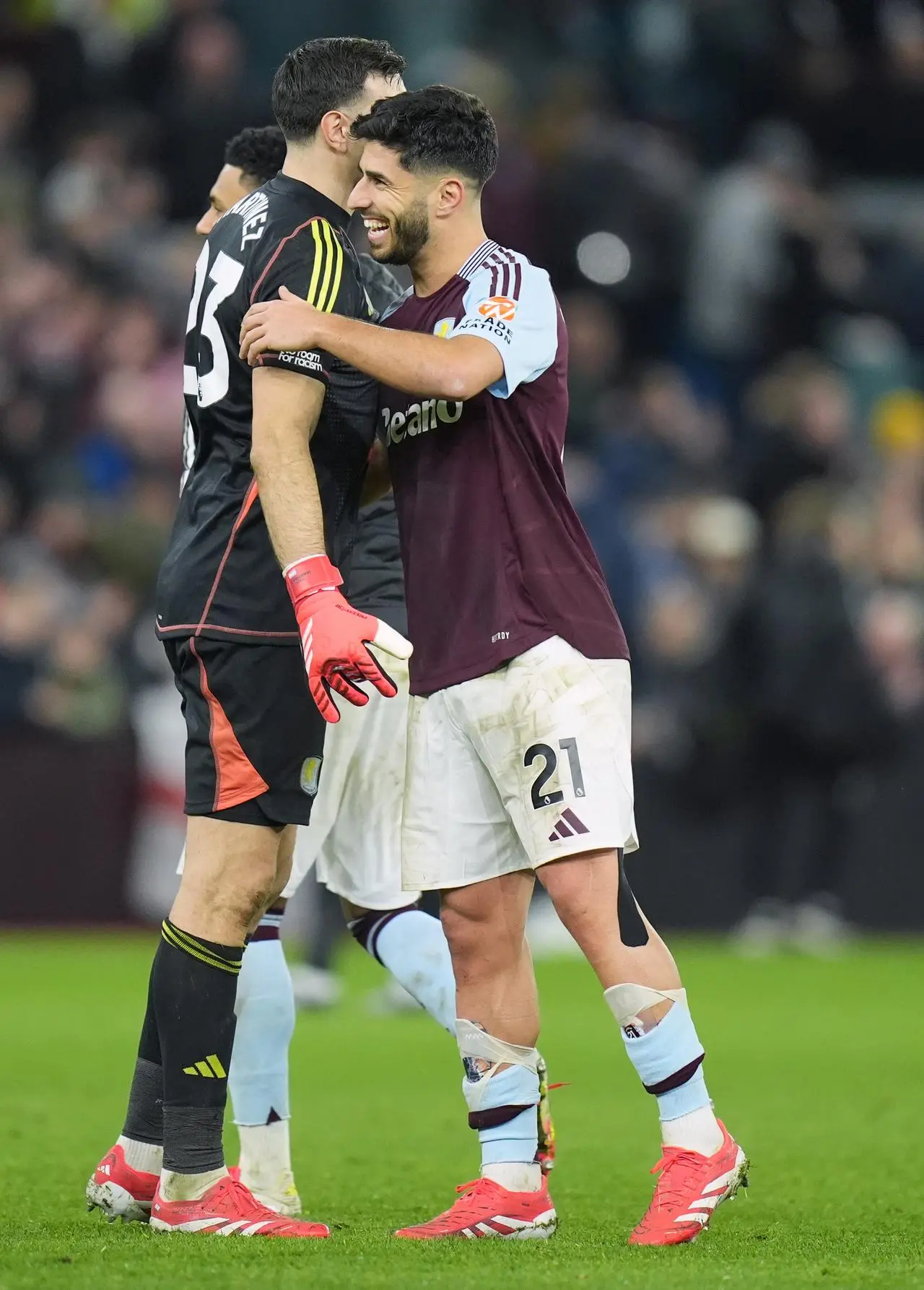 Aston Villa forward Marco Asensio (right) and goalkeeper Emiliano Martinez celebrate together