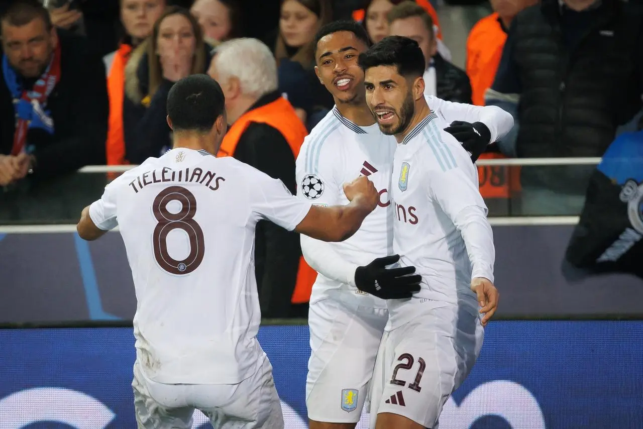 Aston Villa’s Marco Asensio celebrates with team-mates after scoring against Club Brugge