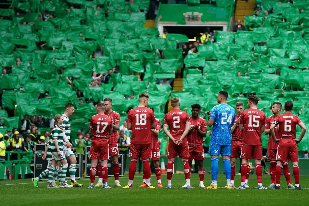 Aberdeen players form a guard on honour for league winners Celtic in May 2023