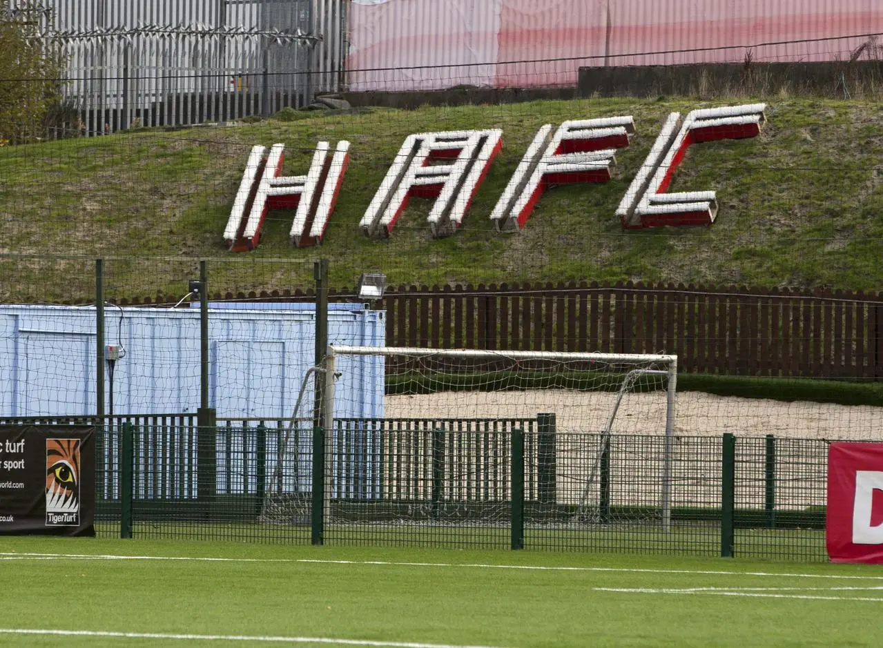 A sign saying 'HAFC' at New Douglas Park