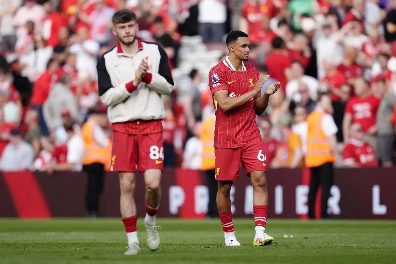 Liverpool’s Conor Bradley and Trent Alexander-Arnold applaud the crowd