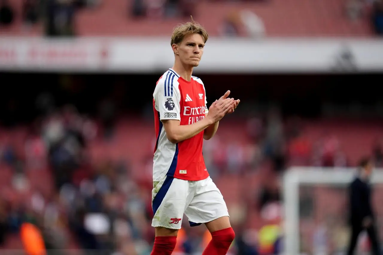 Arsenal’s Martin Odegaard acknowledges the crowd at the final whistle