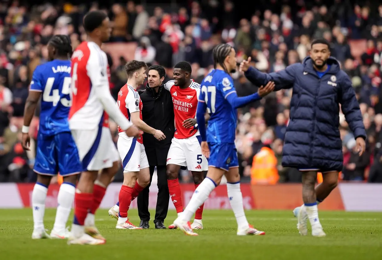 Mikel Arteta, centre, celebrates with Thomas Partey, centre right, after Arsenal's win over Chelsea in March