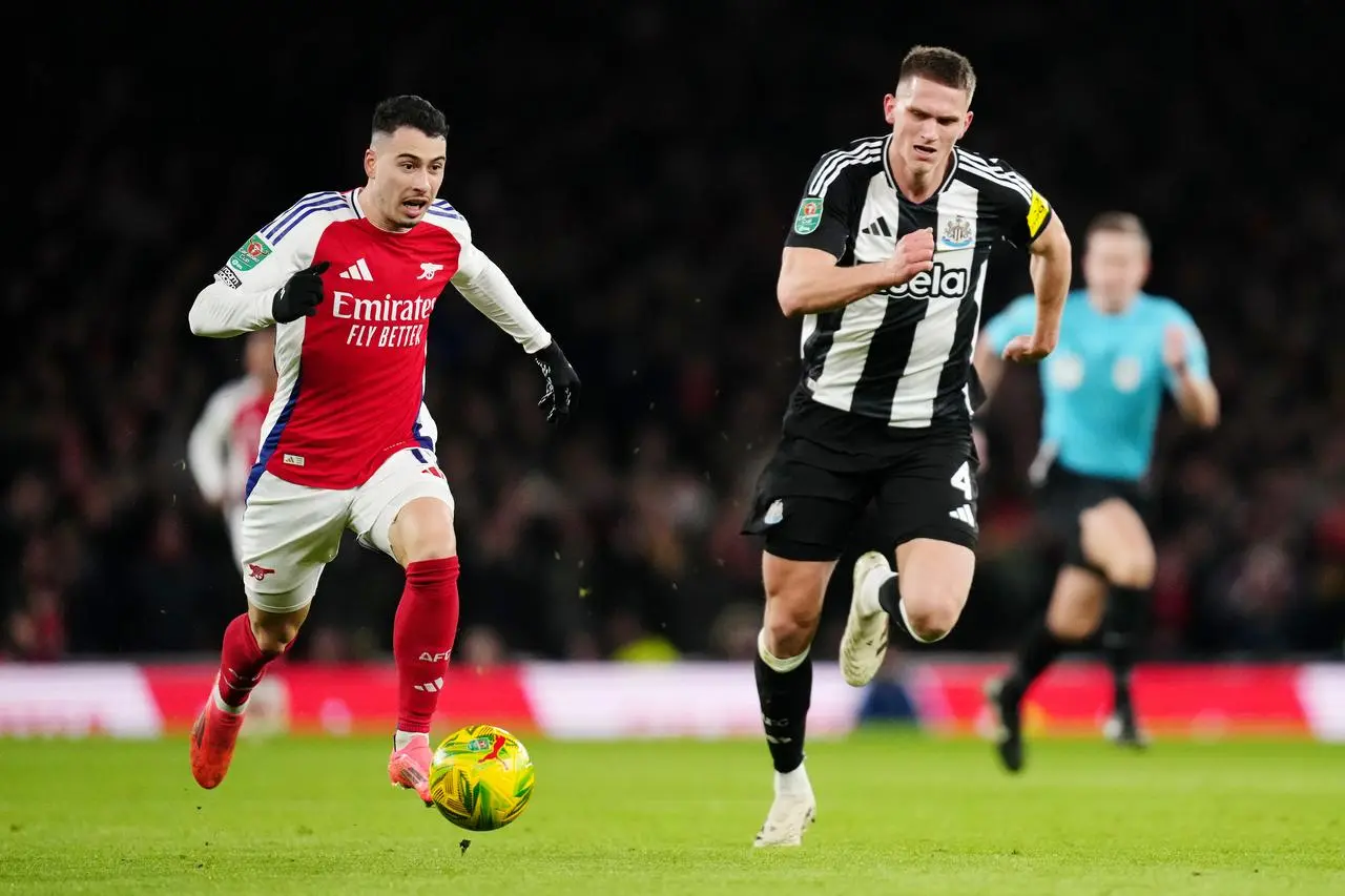Arsenal’s Gabriel Martinelli (left) and Newcastle’s Sven Botman battle for the ball during the Carabao Cup semi-final, first leg match at the Emirates Stadium