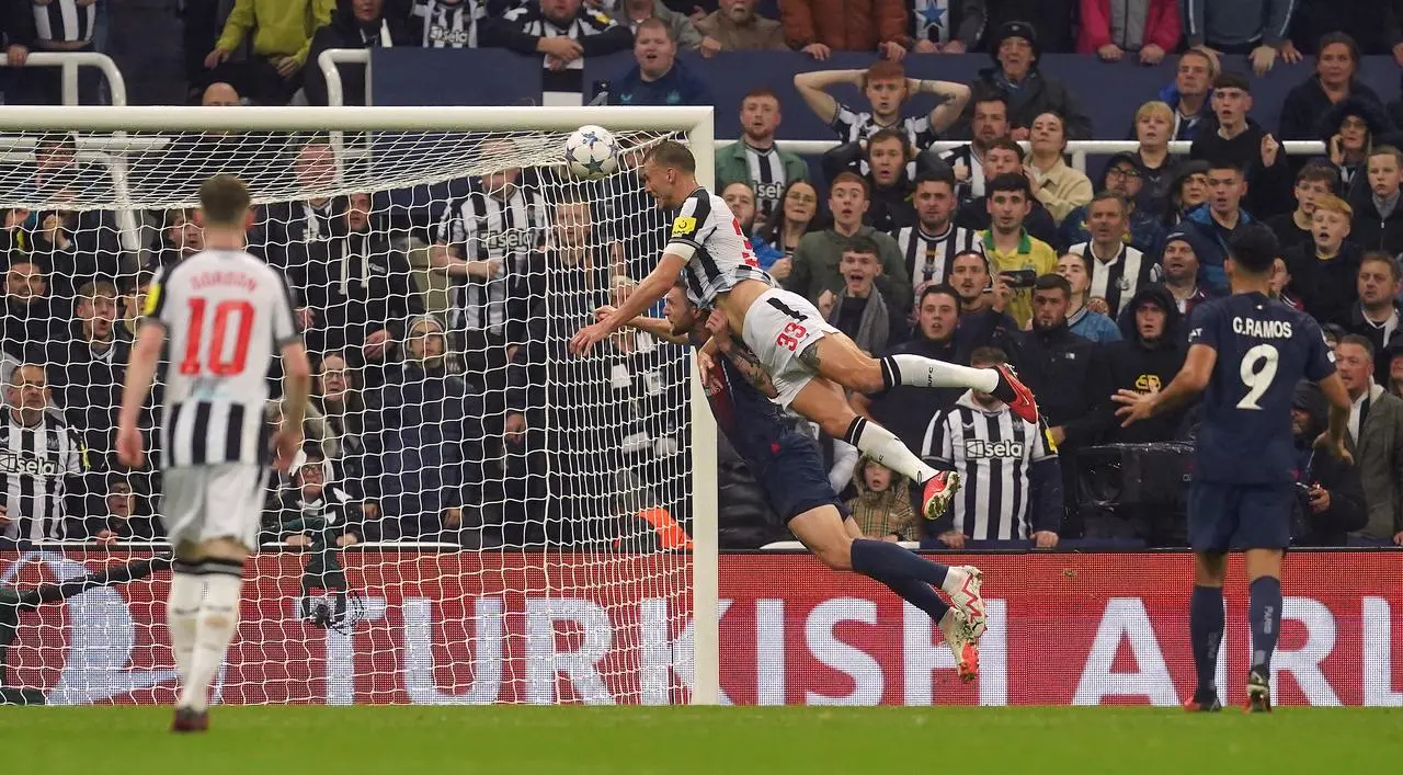 Newcastle defender Dan Burn scores his side’s second goal in a 4-1 Champions League win over Paris St Germain at St James' Park