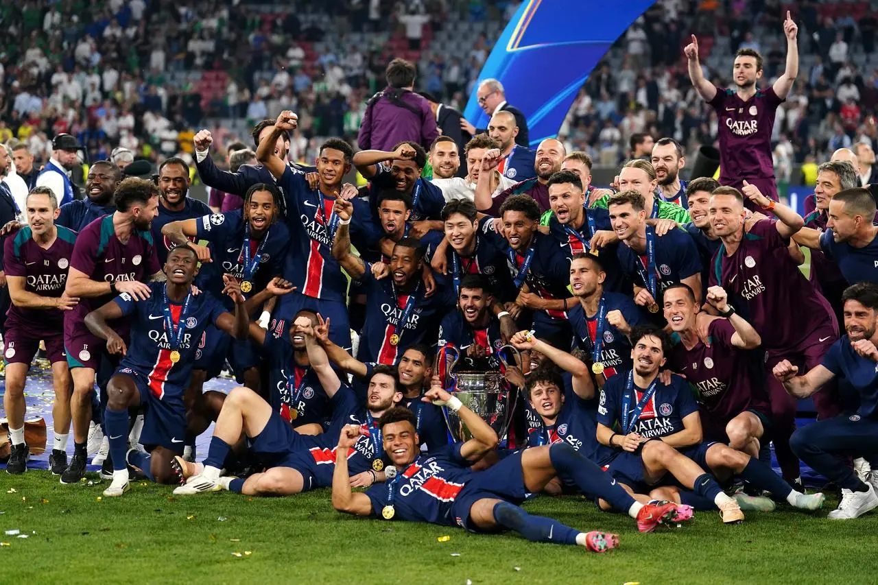 Paris St Germain celebrate with the trophy