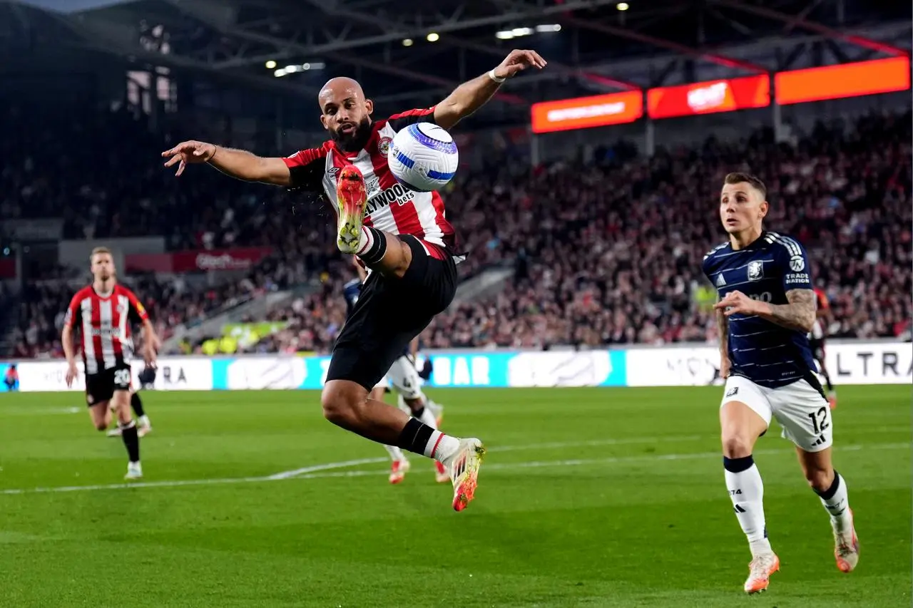 Brentford’s Bryan Mbeumo controls the ball in the air during the home Premier League match against Aston Villa