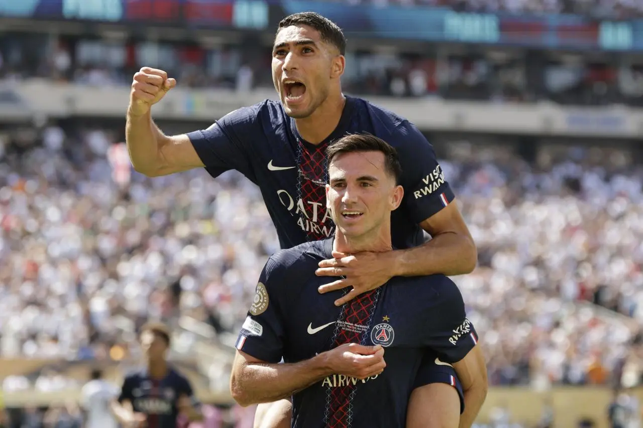 Paris St Germain’s Fabian Ruiz (bottom) celebrates with team mate Achraf Hakimi after scoring against Real Madrid at the Club World Cup